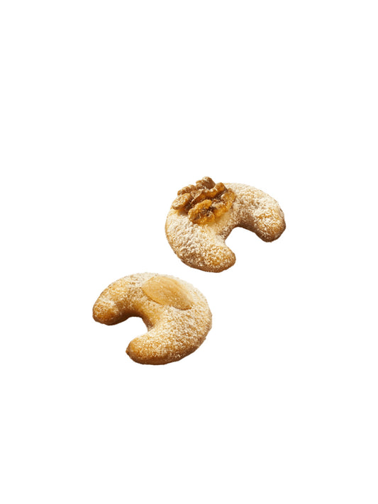 Produktabbildung von Sweet Kipferl von Lembcke – feines Butter-Mürbeteiggebäck mit Mandeln, Walnüssen und Vollmilchschokolade in 100g Packung.