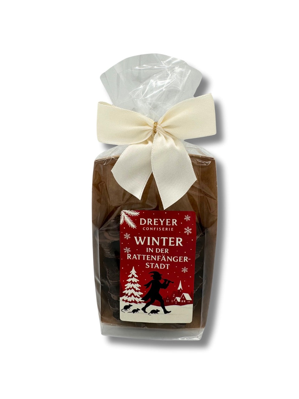 Edelmarzipan Sterne 100 g mit Aufdruck „Winter in der Rattenfängerstadt“, handverpackt mit cremefarbener Schleife, erhältlich in der Dreyer Confiserie in der Rattenfängerstadt Hameln.