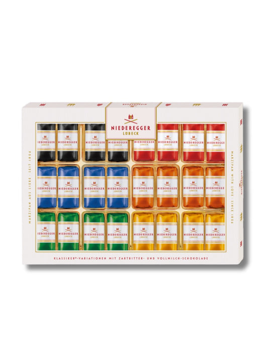 Niederegger Marzipan Klassiker-Variationen 300 g – 24 Pralinen in Zartbitter- und Vollmilch-Schokolade, 6 Sorten: Pistazie, Orange, Ananas, Vollmilch, Classic & Espresso, erhältlich in der Dreyer Confiserie in der Rattenfängerstadt Hameln.