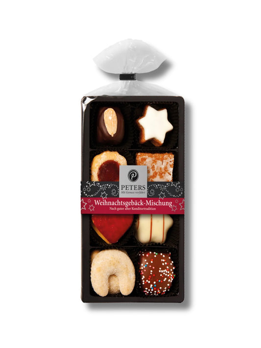 Weihnachtsgebäck-Mischung 100 g von Peters Pralinen – festliche Auswahl mit Zimtsternen, Vanillekipferln, Printen, Honigkuchen und Buttergebäck, erhältlich in der Dreyer Confiserie in der Rattenfängerstadt Hameln.