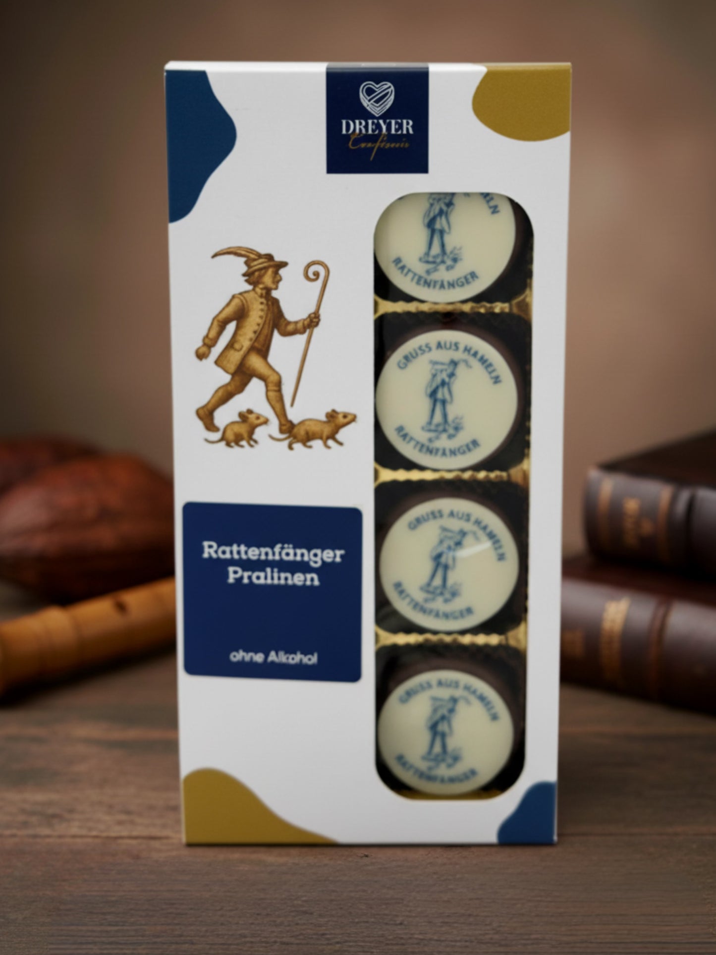 Dreyer Confiserie Signettrüffel Rattenfänger von Hamel. 8 Vollmilch-Trüffel mit Schokoladenaufleger ‚Gruß aus Hameln‘, hergestellt von Wagner Pralinen für die Dreyer Confiserie aus der Hameln.