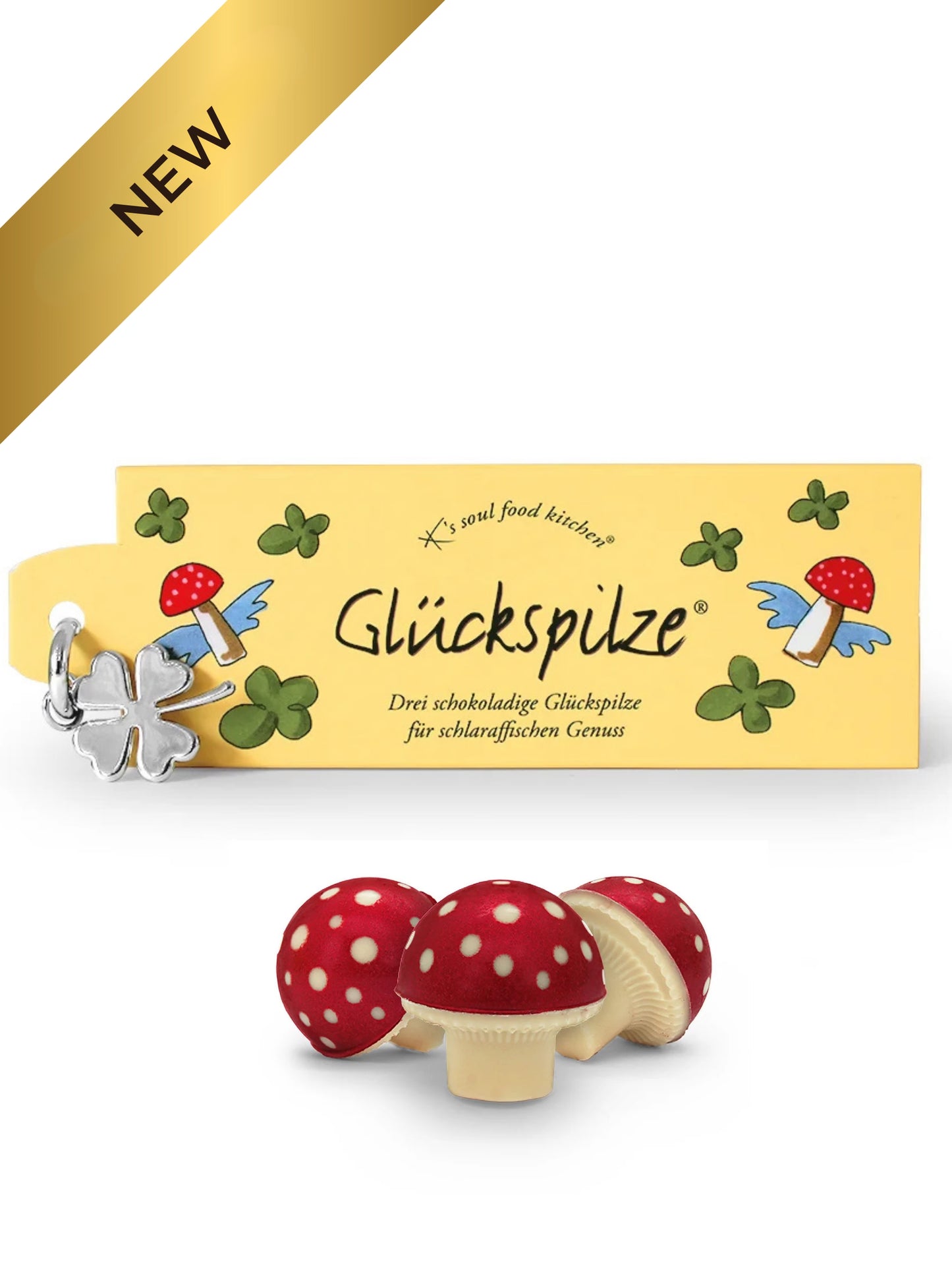 Drei Glückspilze aus weißer Schokolade mit Sahnenougatfüllung und Glücksklee-Anhänger 40g von K’s Soul Food Kitchen®, erhältlich in der Dreyer Confiserie in der Rattenfängerstadt Hameln.