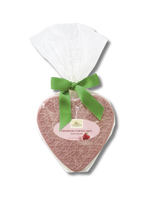 Erdbeer-Cornflakes-Schokoladenherz aus weißer Schokolade mit gefriergetrockneten Erdbeeren und Maisflakes, 95 g, von Lauenstein – dekorativ verpackt, erhältlich bei Dreyer Confiserie.
