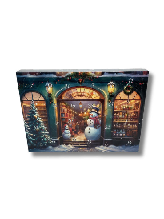 Mini Adventskalender Schneemann 17 g – kleiner Adventskalender mit zarter Milchschokolade und winterlichem Schneemann-Motiv, erhältlich in der Dreyer Confiserie in der Rattenfängerstadt Hameln.