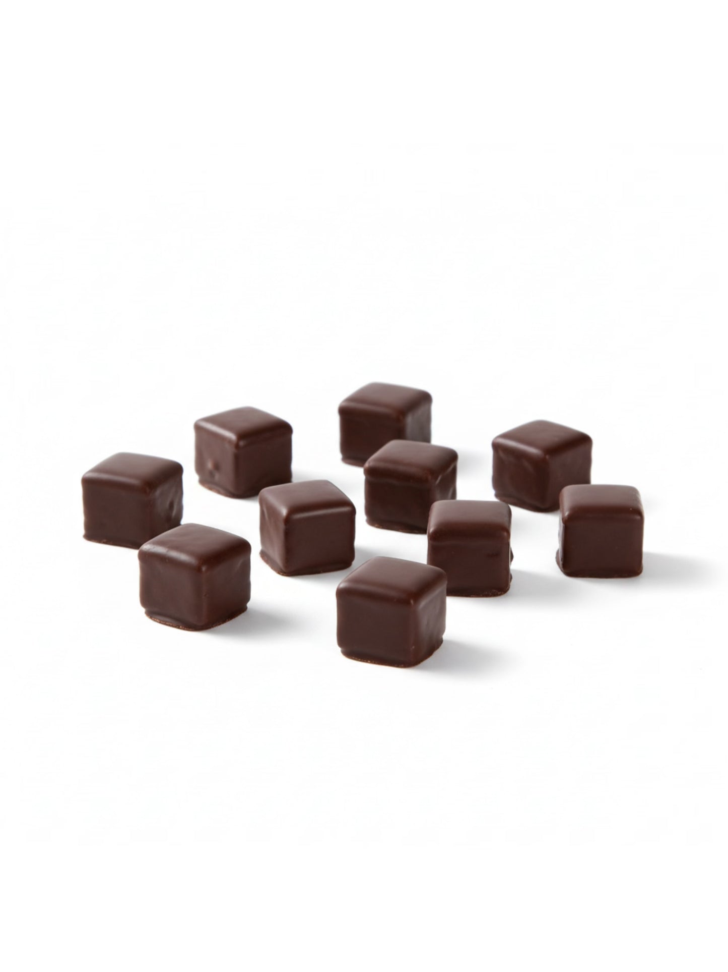 Produktbild von Dominosteine Zartbitter 125 g – fein geschichtetes Weihnachtsgebäck mit Marzipan, Fruchtfüllung und edler Zartbitterschokolade, hergestellt von der Dreyer Confiserie in der Rattenfängerstadt Hameln.