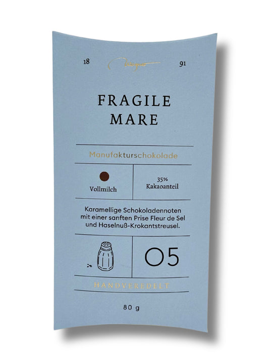 Wagner Manufakturschokolade Fragile Mare – Vollmilchschokolade mit Haselnuss-Krokant und Fleur de Sel, handgeschöpft, erhältlich in der Dreyer Confiserie in der Rattenfängerstadt Hameln.