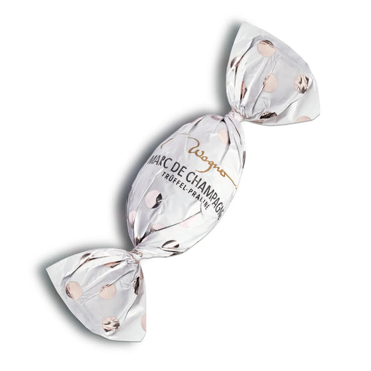 Trüffel-Osterei Marc de Champagne von Wagner – edle Vollmilchschokolade mit feiner Champagner-Trüffelfüllung, erhältlich in der Confiserie Dreyer in der Rattenfängerstadt Hameln. Perfekt für das Osterfest!