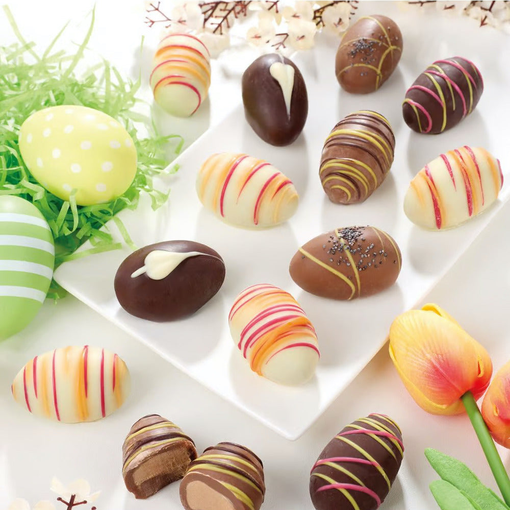 Offene Ansicht der Wagner Pralinen-Eier mit cremiger Trüffelfüllung in drei Schokoladensorten – ideal zu Ostern, erhältlich in Hameln und online bei Dreyer Confiserie.