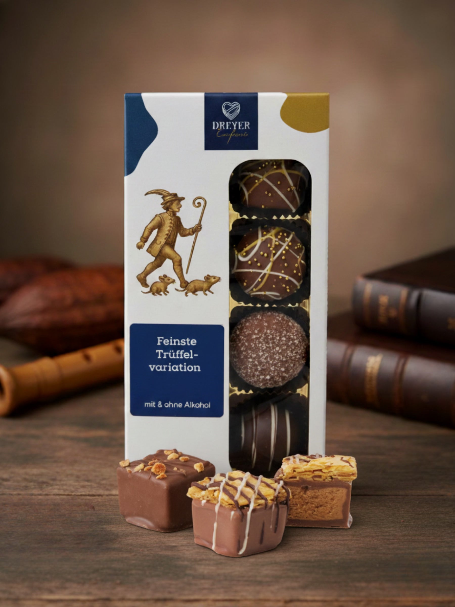 Feinste Trüffelvariationen ohne Alkohol von der Dreyer Confiserie aus Hameln. Inhalt: 100g. Geschenkbox mit 8 Pralinen und Rattenfänger-Motiv , hergestellt von Wagner Pralinen. 