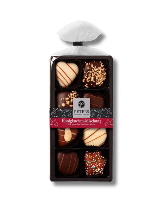 Honigkuchen-Mischung 100 g von Peters Pralinen – edles Weihnachtsgebäck mit hohem Honiganteil, verfeinert mit Kirschwasser und festlichen Gewürzen, erhältlich in der Dreyer Confiserie in der Rattenfängerstadt Hameln.
