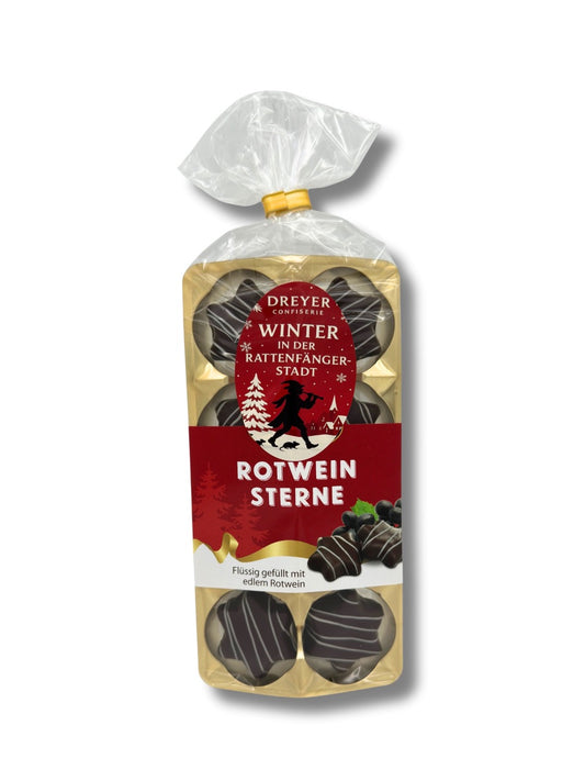 Rotwein Sterne 100 g – Pralinen mit flüssiger Rotweinfüllung in Bitterschokolade, verziert mit weißer Schokolade, erhältlich in der Dreyer Confiserie in der Rattenfängerstadt Hameln.