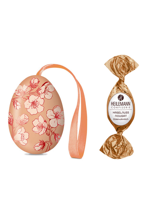 Heilemann Osterei-Dose mit Haselnuss-Nougat-Praliné-Ei 18g aus Edelvollmilchschokolade, dekorative Osterdose mit Praline erhältlich in der Dreyer Confiserie.