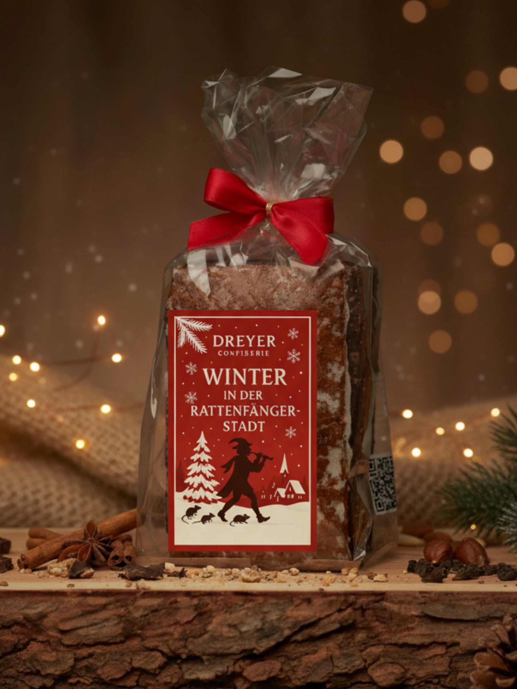 Nürnberger Elisen-Lebkuchen eckig gemischt 400 g – handwerklich gefertigte Lebkuchen mit 35 % Nussanteil, dreifach sortiert in schokoliert, weiß glasiert und natur, im exklusiven „Weihnachten in der Rattenfängerstadt“-Design, erhältlich in der Dreyer Confiserie in Hameln.