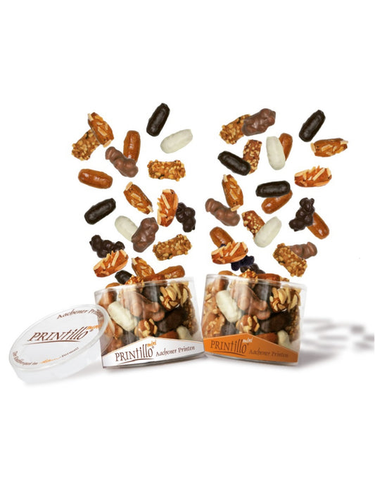 PRINtillo® Mini Mischung 200 g – feine Mini-Aachener Printen mit weißer Schokolade, Haselnüssen und Mandeln in zweifarbiger Dose, erhältlich in der Dreyer Confiserie in der Rattenfängerstadt Hameln.