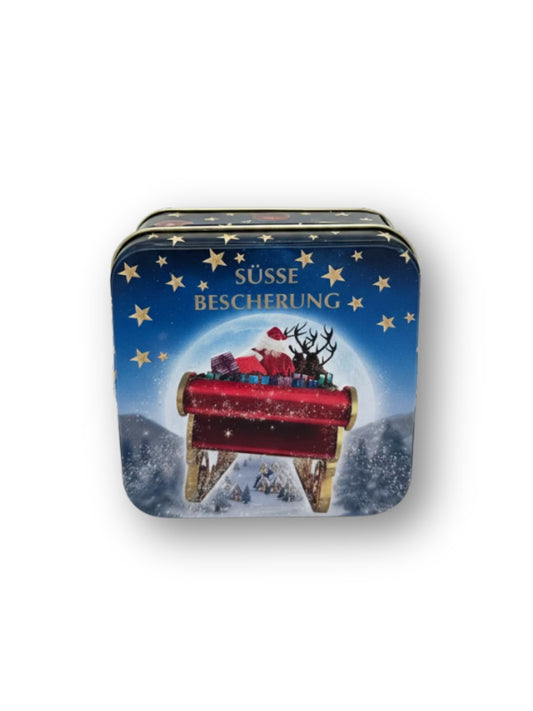 Präsentdose „Süße Bescherung“ 50 g – feine handgefertigte Pralinenmischung in festlicher Metalldose mit Weihnachtsmotiv, erhältlich bei der Dreyer Confiserie in Hameln.