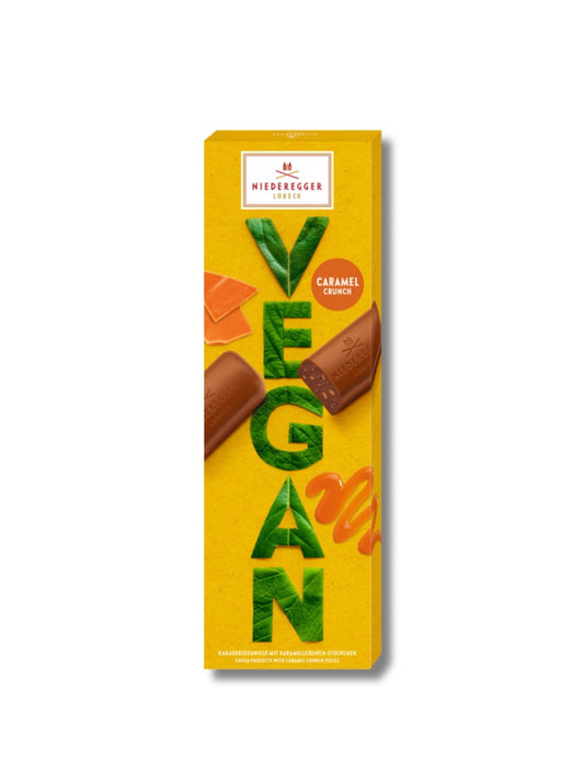 Vegane Caramel Crunch 100g vegane Schokolade mit Karamellstückchen und Kakaocremefüllung erhältlich in der Dreyer Confiserie Hameln und auch online. 