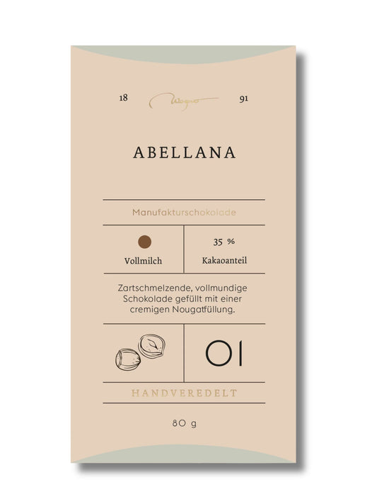 Wagner Manufakturschokolade Abellana Nougat – Vollmilchschokolade mit Nougatfüllung, handgeschöpft, erhältlich in der Dreyer Confiserie in der Rattenfängerstadt Hameln.