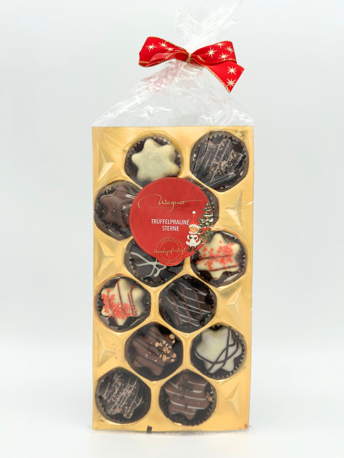 Wagner Trüffelpraline Sterne 140 g, handgefertigte Pralinenmischung mit und ohne Alkohol in festlicher Sternform, erhältlich in der Dreyer Confiserie in der Rattenfängerstadt Hameln.
